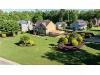 Charming two-story home with a spacious lawn and a convenient covered parking area at 638 Oberlochen Way, Douglasville, GA 30134
