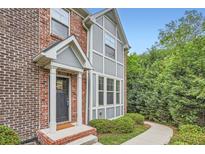 Charming brick home with a covered entryway and well-maintained landscaping at 2300 Whiteoak Drive Southeast Se Dr, Smyrna, GA 30080