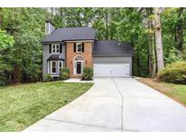 Charming two-story home with brick accents and a well-manicured lawn at 4806 Deer Chase, Powder Springs, GA 30127