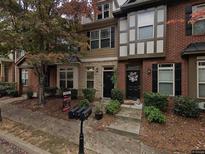 Charming townhome with brick facade, black shutters, and inviting front yard landscaping at 529 Ridge View Crossing Xing, Woodstock, GA 30188