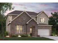 Charming two-story brick home with a well-manicured lawn and attached two-car garage providing great curb appeal at 7175 Brushwood Bend - Lot 36, Lithonia, GA 30058