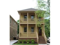 Charming two-story home with a welcoming porch and a well-manicured front yard in a neighborhood at 110 Hogue St, Atlanta, GA 30312