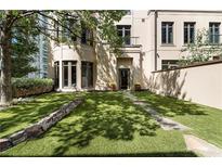Beautiful backyard with lush green grass, stone pavers, and flower pots adding charm to the property at 3376 Peachtree Rd # 1, Atlanta, GA 30326