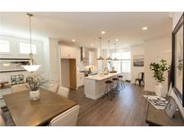 Spacious, modern kitchen with stainless steel appliances and a large island, perfect for entertaining and everyday living at 506 Healy Dr # 74, Cumming, GA 30040