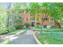 Traditional brick building with manicured landscaping and a welcoming entrance at 1111 Clairemont Ave # N3, Decatur, GA 30030