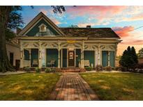 Charming home with a beautiful front porch and a well-maintained lawn and brick path, great curb appeal at 429 Oakland Ave, Atlanta, GA 30312