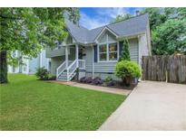 Charming two-story home with a well-maintained lawn and inviting front porch at 756 Joseph E Lowery Sw Blvd, Atlanta, GA 30310