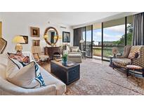 Spacious living room with hardwood floors, elegant furnishings, and access to a private balcony at 2660 Peachtree Rd # 6A, Atlanta, GA 30305