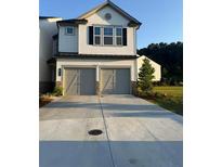 Charming two-story home with a two-car garage and neutral color palette at 3848 Hester St, Duluth, GA 30097