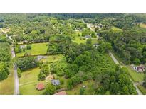 Expansive acreage with mature trees ready for your dream home at 3517 Plunkett Rd, Stonecrest, GA 30038