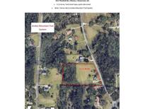 Aerial shot of 3.12 acres of land, showcasing its potential with marked boundaries and lush surroundings at 3517 Plunkett Road Rd, Stonecrest, GA 30038