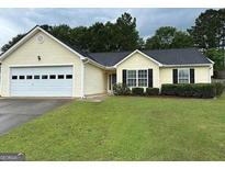 Charming one-story home with well-maintained lawn and a welcoming front entrance at 929 Wexford Way, Auburn, GA 30011