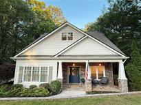 Charming craftsman-style home with a welcoming stone porch and beautiful landscaping at 550 Quillian Ave, Decatur, GA 30032