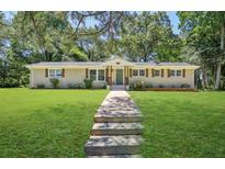 Charming brick home with a manicured lawn and inviting front entrance, great curb appeal at 3301 Irish Ln, Decatur, GA 30032