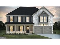 Two-story home featuring a welcoming front porch, gray color palette, and a two-car garage at 1672 Fuma Leaf Way, Mcdonough, GA 30252