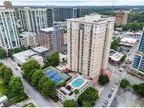 Stunning aerial view of a high-rise condo building with a pool and tennis court at 325 E Paces Ferry Ne Rd # 313, Atlanta, GA 30305