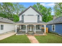 Charming two-story home with a welcoming front porch and beautifully landscaped yard at 1090 Mcdaniel St, Atlanta, GA 30310