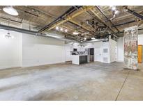 Spacious kitchen features white cabinets, an island and stainless steel appliances at 505 Whitehall Sw St # 102, Atlanta, GA 30303
