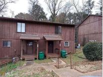 Quaint multi-Gathering home featuring a modest front porch and wooded surroundings at 3502 Sleeping Fawn Knls, Decatur, GA 30034
