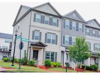 Charming townhome showcasing a well-maintained lawn and inviting entrance, perfect for comfortable living at 3615 Hawthorne Terrace, Atlanta, GA 30337