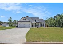 Charming single-Gathering home featuring a 2-car garage, craftsman design, and beautiful landscaping at 461 Barnwood Dr, Rockmart, GA 30153