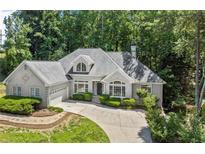 Charming one-story home with stone accents, well-manicured lawn, and mature landscaping in a peaceful neighborhood at 3600 Goldenrod Dr, Alpharetta, GA 30005