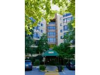 Apartment building exterior featuring the 1800 entrance and lush green trees at 1800 Clairmont Lk # 412, Decatur, GA 30033