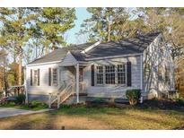Charming single-story home featuring a well-manicured yard and classic design at 1496 S Hairston Rd, Stone Mountain, GA 30088