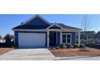 Charming, single-story home with a well-manicured lawn and attached two car garage at 404 Vinca Nw Cir, Kennesaw, GA 30144