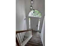 Inviting entryway with natural light and modern lighting fixtures at 5709 Newnan Cir, Austell, GA 30106