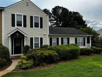 Charming two-story home with black shutters and a well-maintained lawn, showcasing classic suburban appeal at 351 Oak Harbor Trl, Marietta, GA 30066