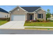 Charming single-story brick home featuring an attached two-car garage and well-manicured front lawn at 740 Pineberry Ct, Grayson, GA 30017
