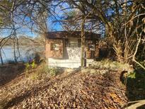 Mobile home exterior near waterfront and foliage at 85 Lang Cir, Covington, GA 30014