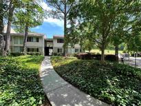 Inviting two-story home with lush landscaping and a charming walkway, perfect for a peaceful retreat at 1503 Wingate Way # 1503, Sandy Springs, GA 30350