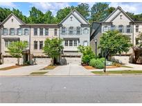 Charming townhomes featuring attached garages, brick accents, and well-maintained landscaping in a desirable neighborhood at 2506 Skyland Ne Dr # 17, Atlanta, GA 30319