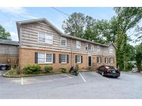 Inviting exterior of a multi-Gathering building with brick facade and ample parking space at 3626 Buford Ne Hwy # C1, Brookhaven, GA 30329