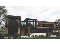 Modern home exterior boasts clean lines, large windows, and a well-manicured lawn, creating a sophisticated curb appeal at 654 Longleaf Dr, Atlanta, GA 30342