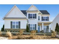 Charming two-story home featuring a stone foundation, white siding, dark shutters, and a cozy front porch at 2905 Medford Drive, Cumming, GA 30041