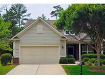 Charming one-story home with a two-car garage, manicured lawn and mature trees offering great curb appeal at 2948 Goldfinch Cir, Marietta, GA 30066
