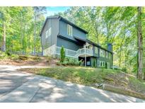 Stunning two-story home featuring a manicured lawn and beautiful landscaping at 510 Watergate Ct, Roswell, GA 30076