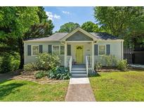 Charming cottage-style home with a welcoming front porch and a beautifully landscaped front yard at 1539 Marbut Se Ave, Atlanta, GA 30316