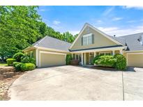 Charming single-Gathering home with a manicured front yard, complemented by an attached two-car garage at 2001 Macland Square Dr # 11, Marietta, GA 30064