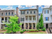 Charming two-story home with stone accents and a welcoming front porch, nestled in a well-maintained community at 221 Thompson St, Alpharetta, GA 30009
