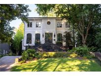 Stunning two-story home with manicured lawn and elegant black brick stairway at 21 Barksdale Ne Dr, Atlanta, GA 30309