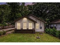 Charming single-story home featuring neutral siding and a welcoming front yard at 523 Mount Zion, Hapeville, GA 30354