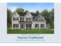 Charming two-story home with classic architectural details and a beautifully landscaped front yard at 2465 Bleckley Pl, Cumming, GA 30041