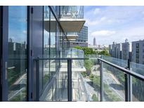 Condo balcony featuring glass railings with a view of the city skyline at 788 W Marietta Nw St # 311, Atlanta, GA 30318