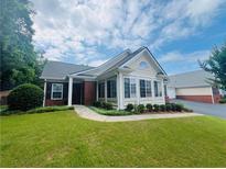 Charming single-story home with manicured lawn, brick accents, and bright sunroom at 1535 Duluth Hwy # 1101, Lawrenceville, GA 30043