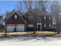Charming two-story home with a well-maintained lawn and mature trees, offering great curb appeal at 5755 Belmont Ridge Cir, Lithonia, GA 30038