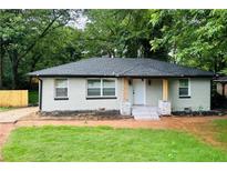 Charming single-story home with a freshly painted exterior, new roof, and a cozy front porch at 2793 Gresham Se Rd, Atlanta, GA 30316
